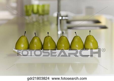 Artificial pears on a table View Large Photo Image Picture - Artificial pears on a table. Fotosearch