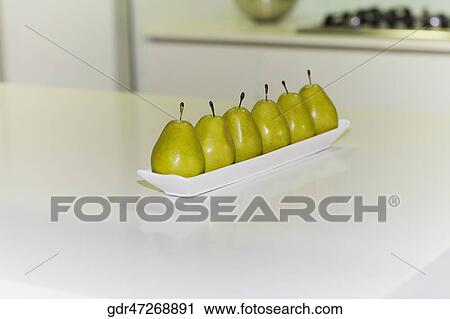 Artificial pears on a table View Large Photo Image Stock Image - Artificial pears on a table. Fotosearch