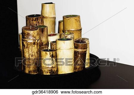 Bamboo shaped candles in a tray View Large Photo Image Stock Photograph - Bamboo shaped candles in a tray. Fotosearch