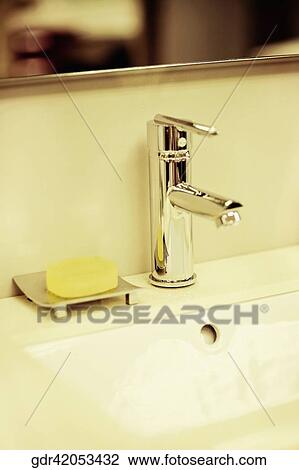 Bar of soap on a bathroom sink View Large Photo Image Stock Image - Bar of soap on a bathroom sink. Fotosearch