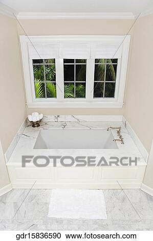 Stock Image - Bathtub in a bathroom. Fotosearch