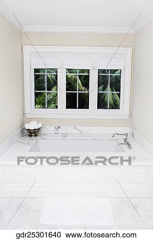 Stock Image - Bathtub in a bathroom. Fotosearch
