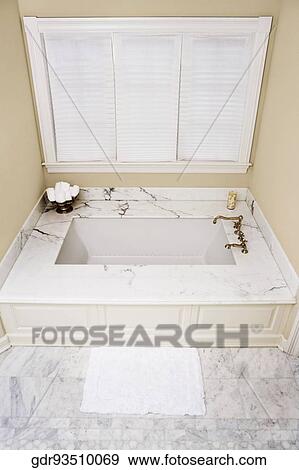 Stock Photo - Bathtub in a bathroom. Fotosearch