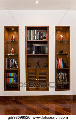 Book shelf in a living room View Large Photo Image Stock Photograph - Book shelf in a living room. Fotosearch