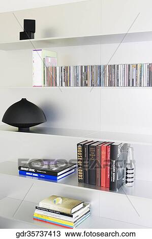 Books and showpiece on shelves View Large Photo Image Stock Image - Books and showpiece on shelves. Fotosearch
