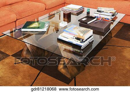 Books on a table in a drawing room View Large Photo Image Stock Photo - Books on a table in a drawing room. Fotosearch