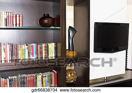 Picture - Bookshelf in a living room. Fotosearch