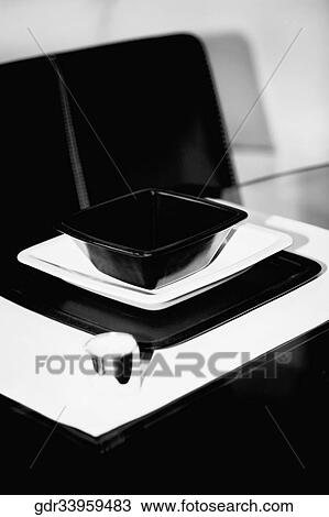 Bowl and a tray on a dining table View Large Photo Image Stock Image - Bowl and a tray on a dining table. Fotosearch