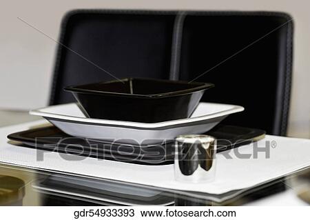 Bowl and a tray on a dining table View Large Photo Image Stock Image - Bowl and a tray on a dining table. Fotosearch