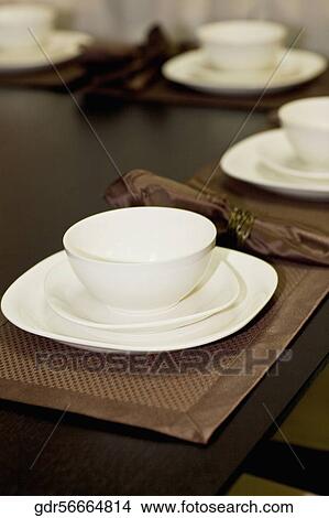 Picture - Bowl and plates on a dining table. Fotosearch