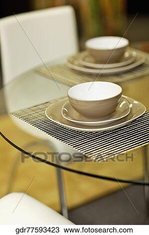 Bowls and plates on a dining table View Large Photo Image Stock Image - Bowls and plates on a dining table. Fotosearch