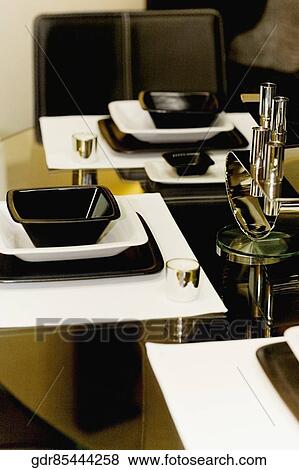Bowls and trays on a dining table View Large Photo Image Stock Photo - Bowls and trays on a dining table. Fotosearch
