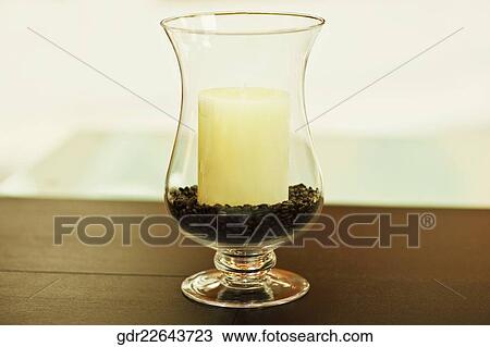 Stock Image - Candle on a table. Fotosearch