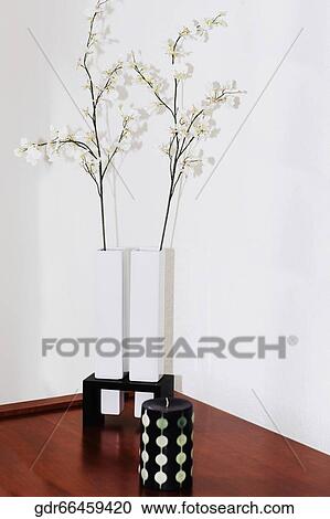 Candle with flowers on a table View Large Photo Image Stock Image - Candle with flowers on a table. Fotosearch
