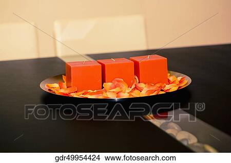 Candles and rose petals in a plate on a table View Large Photo Image Picture - Candles and rose petals in a plate on a table. Fotosearch