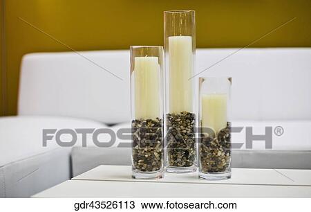 Candles in candlestick holders on a table View Large Photo Image Stock Image - Candles in candlestick holders on a table. Fotosearch