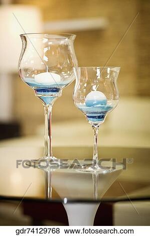 Candles in stem glasses View Large Photo Image Stock Photo - Candles in stem glasses. Fotosearch