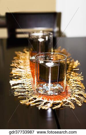Candles on a table View Large Photo Image Stock Photo - Candles on a table. Fotosearch