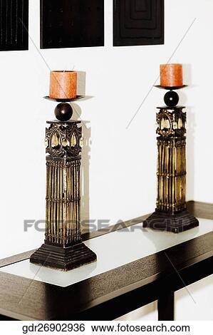 Candles on a table View Large Photo Image Stock Photograph - Candles on a table. Fotosearch