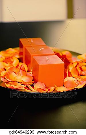 Candles with rose petals on a plate View Large Photo Image Stock Image - Candles with rose petals on a plate. Fotosearch