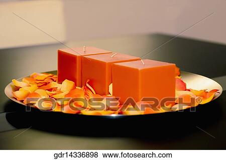 Candles with rose petals on a plate View Large Photo Image Stock Photo - Candles with rose petals on a plate. Fotosearch