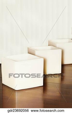 Stock Photograph - Candlestick holders on a dining table. Fotosearch