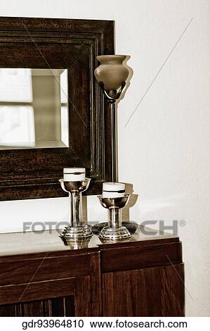 Candlestick holders on a sideboard View Large Photo Image Stock Image - Candlestick holders on a sideboard. Fotosearch