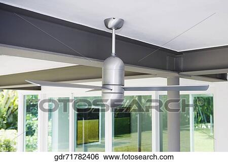 Ceiling fan hanging on a roof View Large Photo Image Stock Photograph - Ceiling fan hanging on a roof. Fotosearch
