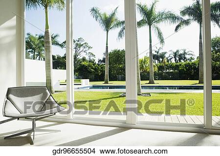 Chair near a window View Large Photo Image Picture - Chair near a window. Fotosearch