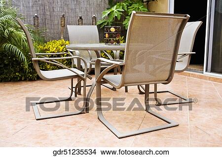 Chairs around a table View Large Photo Image Picture - Chairs around a table. Fotosearch