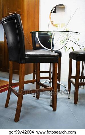 Chairs in a dining room View Large Photo Image Picture - Chairs in a dining room. Fotosearch