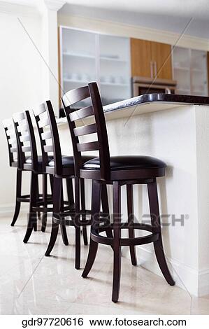 Chairs in the kitchen View Large Photo Image Stock Photograph - Chairs in the kitchen. Fotosearch