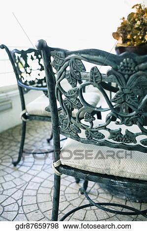 Chairs with a table in a living room View Large Photo Image Stock Photo - Chairs with a table in a living room. Fotosearch