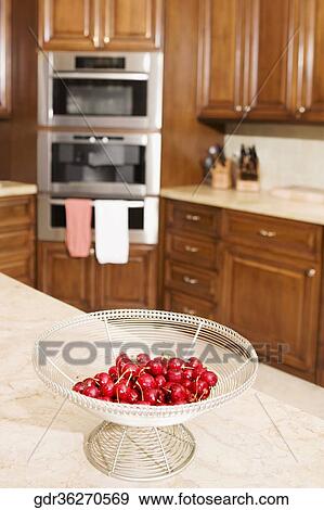 Cherries bowl in a domestic kitchen View Large Photo Image Stock Photo - Cherries bowl in a domestic kitchen. Fotosearch