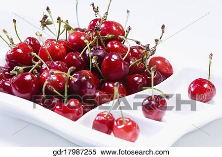 Cherries in a tray on a table View Large Photo Image Stock Photography - Cherries in a tray on a table. Fotosearch