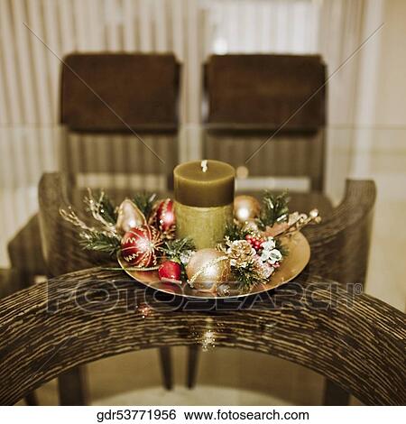 Christmas ornaments with candle on a table View Large Photo Image Stock Photograph - Christmas ornaments with candle on a table. Fotosearch