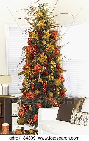 Christmas tree in a living room View Large Photo Image Stock Photo - Christmas tree in a living room. Fotosearch