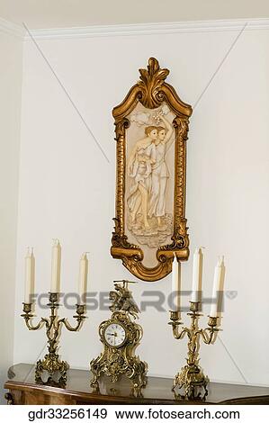 Clock and candlestick holders on a table View Large Photo Image Stock Photo - Clock and candlestick holders on a table. Fotosearch