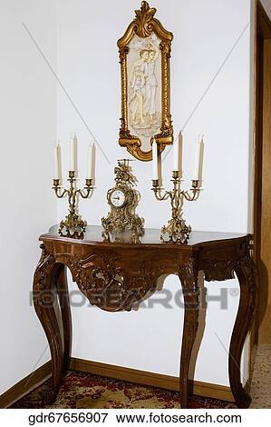 Clock and candlestick holders on a table View Large Photo Image Stock Photo - Clock and candlestick holders on a table. Fotosearch
