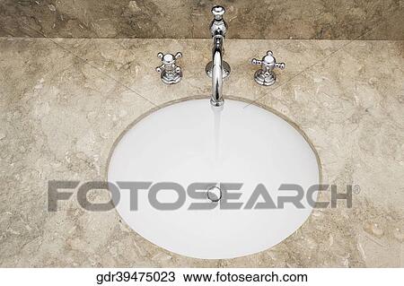 Close-up of a bathroom sink View Large Photo Image Stock Image - Close-up of a bathroom sink. Fotosearch