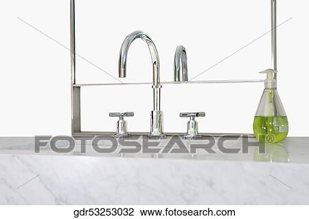 Stock Image - Close-up of a bathroom sink. Fotosearch