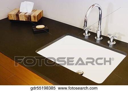 Stock Photography - Close-up of a bathroom sink. Fotosearch