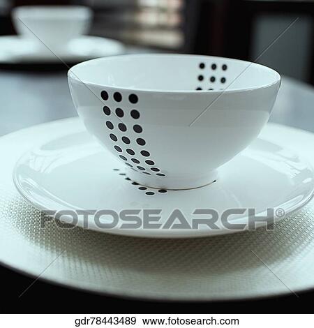 Close-up of a bowl on a plate View Large Photo Image Stock Photo - Close-up of a bowl on a plate. Fotosearch