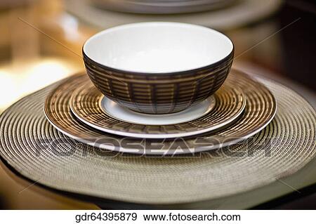 Close-up of a bowl on a saucer View Large Photo Image Stock Photo - Close-up of a bowl on a saucer. Fotosearch