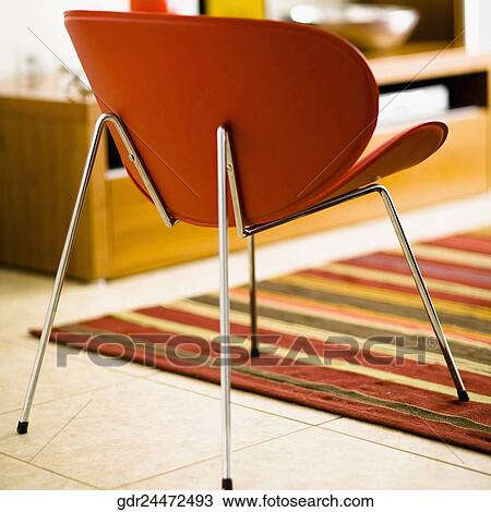 Close-up of a chair in a living room View Large Photo Image Stock Image - Close-up of a chair in a living room. Fotosearch