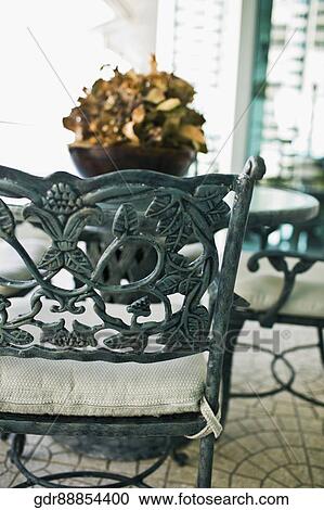 Close-up of a chair with a table View Large Photo Image Stock Image - Close-up of a chair with a table. Fotosearch