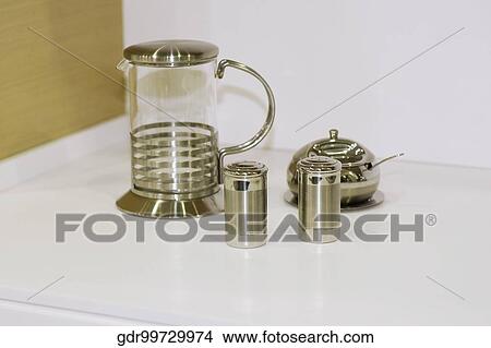 Close-up of a jug with salt shaker and pepper shaker View Large Photo Image Picture - Close-up of a jug with salt shaker and pepper shaker. Fotosearch