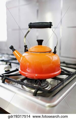 Close-up of a kettle on a stove View Large Photo Image Picture - Close-up of a kettle on a stove. Fotosearch