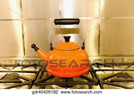 Close-up of a kettle on a stove View Large Photo Image Stock Image - Close-up of a kettle on a stove. Fotosearch