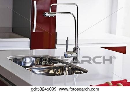 Stock Photo - Close-up of a kitchen sink. Fotosearch